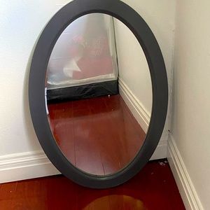 Grey oval mirror